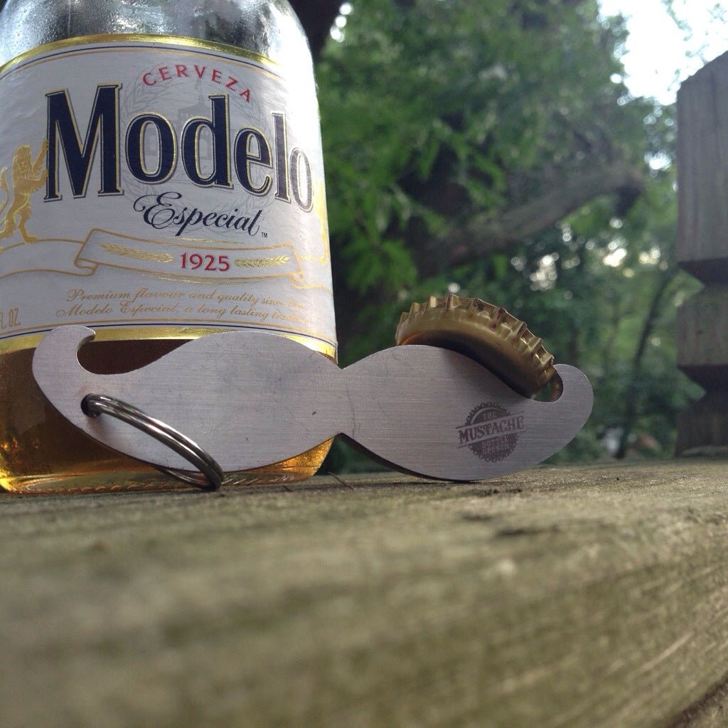 Mustache bottle opener next to beer