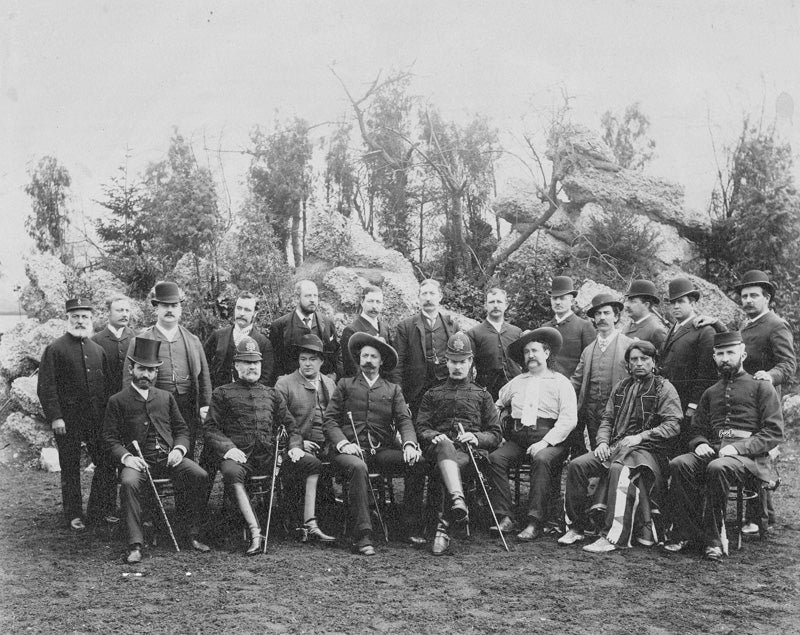 Group of men posing for old photo