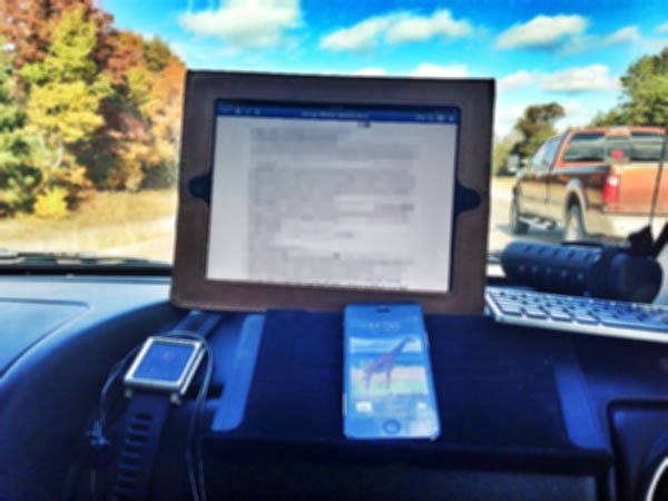 Office on the road ipad and iphone on dashboard