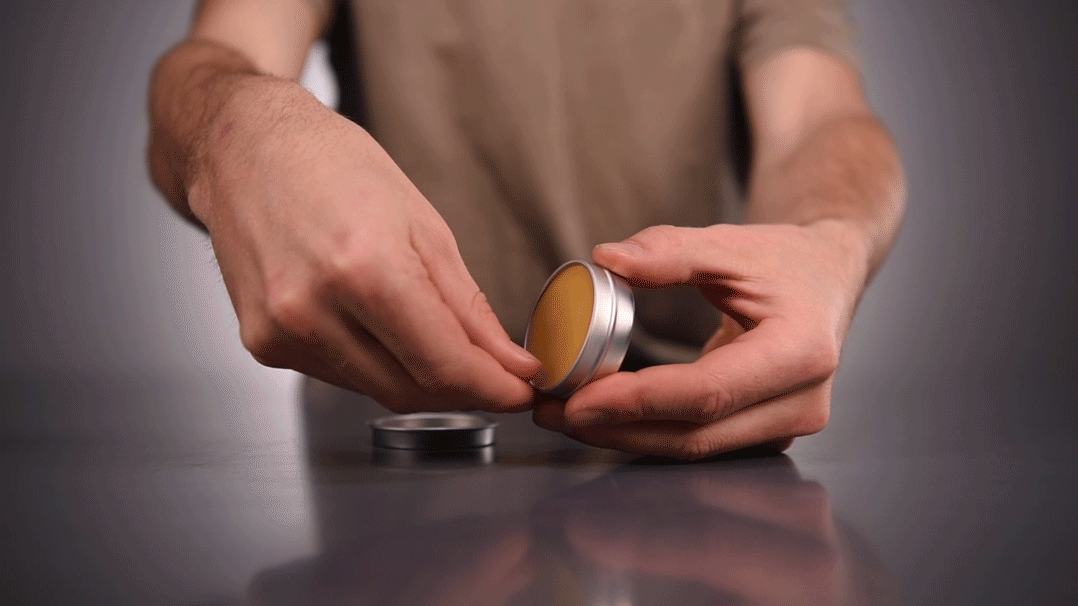 carve out a portion of moustache wax (about the size of a grain of rice)